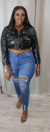 She’s  a faux cropped leather jacket
