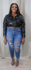 She’s  a faux cropped leather jacket
