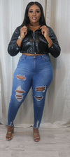 She’s  a faux cropped leather jacket